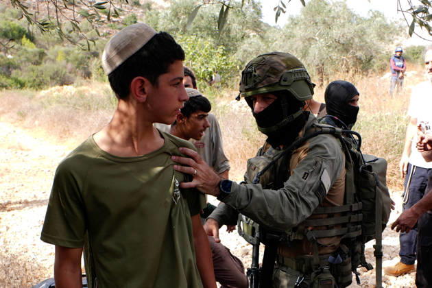 Clashes erupt between Israeli settlers and Palestinian farmers in West Bank RAMALLAH, WEST BANK - OCTOBER 9: Clashes break out between Israeli settlers, accompanied by Israeli soldiers, and Palestinian farmers harvesting olives in the town of Deir Ibzi, near Ramallah in West Bank, on October 9, 2026. The incident reportedly involved damage to olive crops and provocative actions by the settlers. Issam Rimawi Anadolu West Bank Palestine. Editorial use only. Please get in touch for any other usage. Copyright: x2026xAnadoluxIssamxRimawix