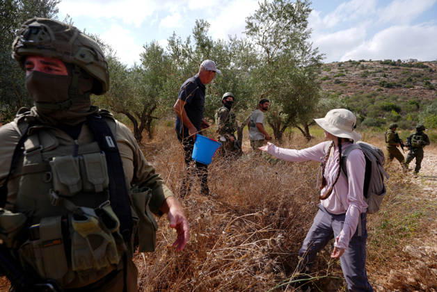 Clashes erupt between Israeli settlers and Palestinian farmers in West Bank RAMALLAH, WEST BANK - OCTOBER 9: Clashes break out between Israeli settlers, accompanied by Israeli soldiers, and Palestinian farmers harvesting olives in the town of Deir Ibzi, near Ramallah in West Bank, on October 9, 2026. The incident reportedly involved damage to olive crops and provocative actions by the settlers. Issam Rimawi Anadolu West Bank Palestine. Editorial use only. Please get in touch for any other usage. Copyright: x2026xAnadoluxIssamxRimawix