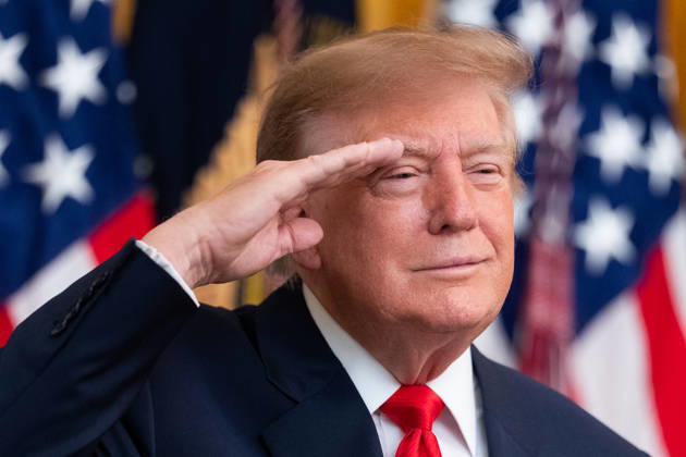 President Donald Trump salutes during the National Anthem during an event in the East Room of the White House in Washington, DC on Friday, Oct. 9, 2026. Trump is hosting a Columbus Day celebration. WASP20261009131 AaronxSchwartz