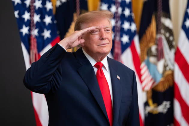 President Donald Trump salutes during the National Anthem during an event in the East Room of the White House in Washington, DC on Friday, Oct. 9, 2026. Trump is hosting a Columbus Day celebration. WASP20261009132 AaronxSchwartz