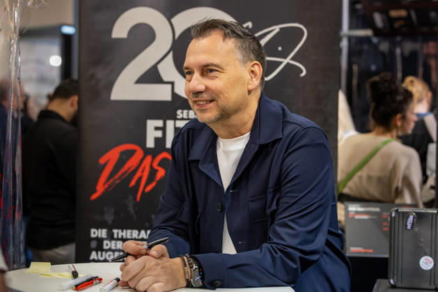 Sebastian Fitzek at the Frankfurt Book Fair, October 9, 2026. German bestselling author and thriller writer Sebastian Fitzek at a book-signing event at the 2026 Frankfurt Book Fair. At the booth of his publisher, Droemer Knau
