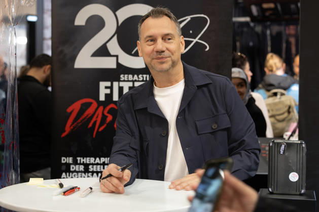 Sebastian Fitzek at the Frankfurt Book Fair, October 9, 2026. German bestselling author and thriller writer Sebastian Fitzek at a book-signing event at the 2026 Frankfurt Book Fair. At the booth of his publisher, Droemer Knau