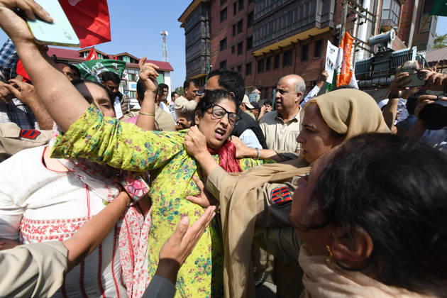 October 10, 2026, Srinagar, Jammu And Kashmir, India: Police personnel try to stop supporters of the opposition alliance INDIA bloc (Indian National Developmental Inclusive Alliance) during a protest demanding the resignation of India s Chief Election Commissioner Gyanesh Kumar over alleged voter roll irregularities linked to the special intensive revision (SIR), in Srinagar on October 10, 2026. Srinagar India  - ZUMAz120 20261010_zip_z120_017 Copyright: xBasitxZargarx