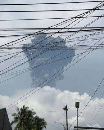 (261010) -- NEGROS ISLAND, Oct. 10, 2026 -- A thick plume is seen over the sky as Mount Kanlaon Volcano erupts in Negros Island, the Philippines, on Oct. 10, 2026. Mount Kanlaon Volcano in the central Philippines erupted just over noon Saturday, the Philippine Institute of Volcanology and Seismology said. The institute said the event generated a plume that rose 5 km to 6 km above the crater. The ashfall is expected to drift north and northeast. ( Handout via Xinhua) PHILIPPINES-NEGROS ISLAND-MOUNT KANLAON VOLCANO-ERUPTION NationalxDisasterxRiskxReductionxandxManagementxCouncil