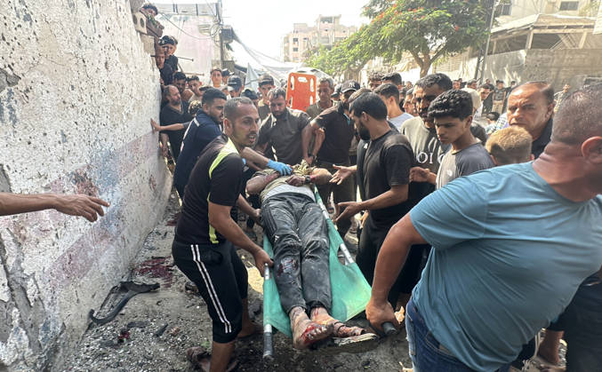 Palestinians Transport Dead and Wounded Following Israeli Airstrike in Gaza City Palestinians transport the bodies of people killed and others wounded to al-Shifa Hospital in Gaza City, on October 10, 2026, following an Israeli airstrike targeting a group of Palestinians in the western part of the city. Photo by Mohammed Salha apaimages Gaza Gaza Strip Palestinian Territory 101026_Gaza_MS_00(4) Copyright: xapaimagesxMohammedxSalhax xapaimagesx