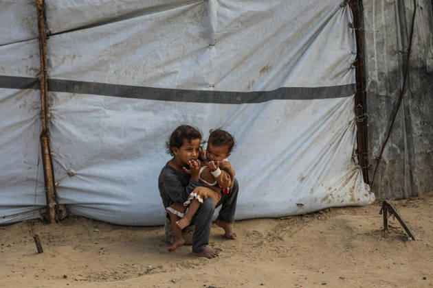 Palestinians still lack basic necessities amid Israel attacks DEIR AL BALAH, GAZA, PALESTINE - OCTOBER 10: Palestinians living in tents set up in the Bureij area carry water in containers to their makeshift shelters in Deir al Balah, Gaza, Palestine on October 10, 2026.The humanitarian crisis in the region continues to deepen, with thousands of displaced families struggling to survive without access to the most basic necessities. Adam Bilal Anadolu Deir al Balah Gaza. Editorial use only. Please get in touch for any other usage. Copyright: x2026xAnadoluxAdamxBilalx