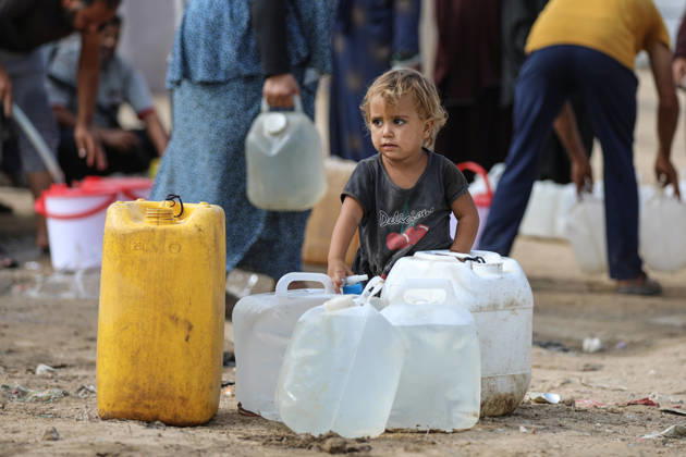Palestinians still lack basic necessities amid Israel attacks DEIR AL BALAH, GAZA, PALESTINE - OCTOBER 10: Palestinians living in tents set up in the Bureij area carry water in containers to their makeshift shelters in Deir al Balah, Gaza, Palestine on October 10, 2026.The humanitarian crisis in the region continues to deepen, with thousands of displaced families struggling to survive without access to the most basic necessities. Adam Bilal Anadolu Deir al Balah Gaza. Editorial use only. Please get in touch for any other usage. Copyright: x2026xAnadoluxAdamxBilalx