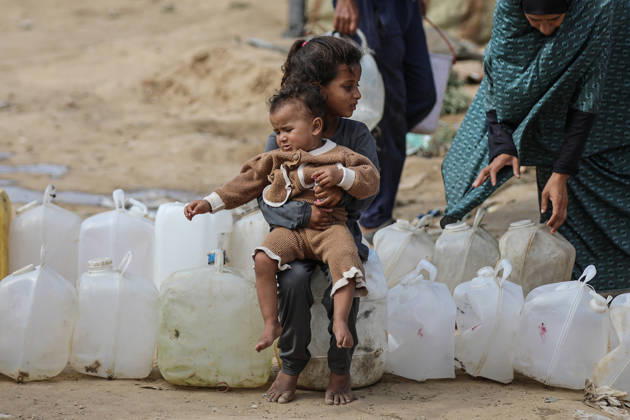 Palestinians still lack basic necessities amid Israel attacks DEIR AL BALAH, GAZA, PALESTINE - OCTOBER 10: Palestinians living in tents set up in the Bureij area carry water in containers to their makeshift shelters in Deir al Balah, Gaza, Palestine on October 10, 2026.The humanitarian crisis in the region continues to deepen, with thousands of displaced families struggling to survive without access to the most basic necessities. Adam Bilal Anadolu Deir al Balah Gaza. Editorial use only. Please get in touch for any other usage. Copyright: x2026xAnadoluxAdamxBilalx