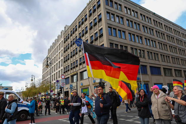 October 10, 2026, Berlin, Berlin, Germany: Demonstrators gather in Berlin for the Project M1llion rally against the German government. Participants take to the streets to voice their opposition to government policies, displaying banners and expressing their political demands. The demonstration brings together people seeking to make their concerns heard and draw public attention to their criticism of the country s political leadership. Berlin Germany - ZUMAc291 20261010_zip_c291_006 Copyright: xMariaxCastrox