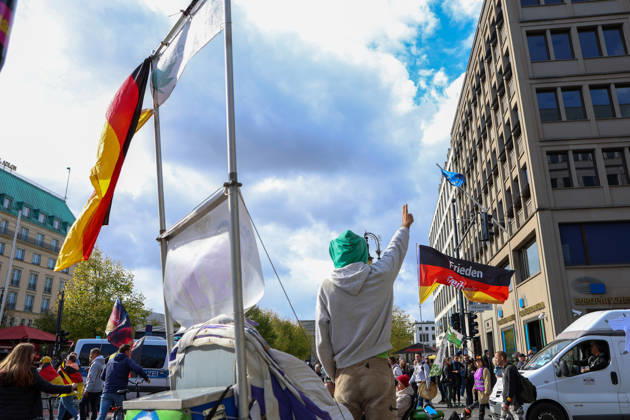 October 10, 2026, Berlin, Berlin, Germany: Demonstrators gather in Berlin for the Project M1llion rally against the German government. Participants take to the streets to voice their opposition to government policies, displaying banners and expressing their political demands. The demonstration brings together people seeking to make their concerns heard and draw public attention to their criticism of the country s political leadership. Berlin Germany - ZUMAc291 20261010_zip_c291_003 Copyright: xMariaxCastrox