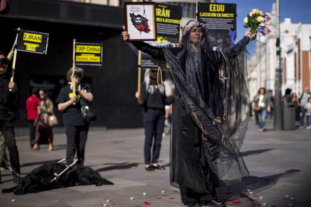 October 10, 2026, Madrid, Spain: A woman holds a portrait, wearing a veil on her head during a rally against the death penalty in Callao Square in central Madrid. World Day Against the Death Penalty has been observed every October 10th since 2003. Madrid Spain - ZUMAs197 20261010_aaa_s197_020 Copyright: xLuisxSotox