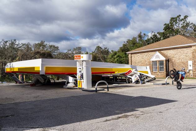 October 10, 2026, Gulf Shores, Fl, USA: A child rides his bike past a Shell gas station that collapsed after Hurricane Isaias came ashore..Hurricane Isaias made landfall Friday, October 9 along the U.S. Gulf coast. Gulf Shores USA - ZUMAs197 20261010_aaa_s197_027 Copyright: xJenxGolbeckx