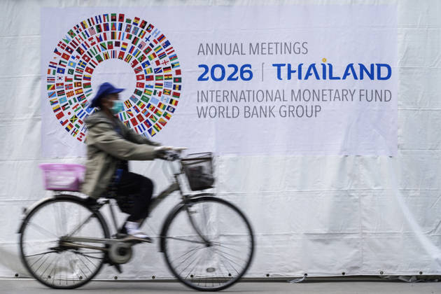 IMF World Bank 2026 Annual Meetings In Bangkok. A woman rides a bicycle past a banner ahead of the annual meetings of the International Monetary Fund (IMF) and the World Bank Group, at the Queen Sirikit National Convention Center in Bangkok, Thailand, on October 10, 2026. Bangkok Bangkok Thailand  Copyright: xAnusakxLaowilasx originalFilename: laowilas-notitle261010_npEjM.jpg