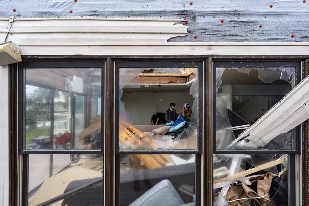 October 10, 2026, Pensacola Beach, Fl, USA: Laura and Alex Dean clean out their home that was severely damaged during Hurricane Isaias..Hurricane Isaias made landfall Friday, October 9 along the U.S. Gulf coast. Pensacola Beach USA - ZUMAs197 20261010_aaa_s197_031 Copyright: xJenxGolbeckx