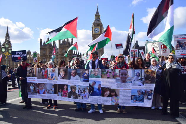 October 10, 2026, London, England, United Kingdom: Protesters pass over Westminster Bridge past the Houses of Parliament as thousands of people march in support of Palestine. The protesters also called on the government to stop arming Israel and for sanctions on Israel. London United Kingdom  - ZUMAv130 20261010_zip_v130_033 Copyright: xVukxValcicx