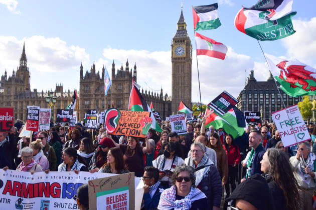 October 10, 2026, London, England, United Kingdom: Protesters pass over Westminster Bridge past the Houses of Parliament as thousands of people march in support of Palestine. The protesters also called on the government to stop arming Israel and for sanctions on Israel. London United Kingdom  - ZUMAv130 20261010_zip_v130_036 Copyright: xVukxValcicx