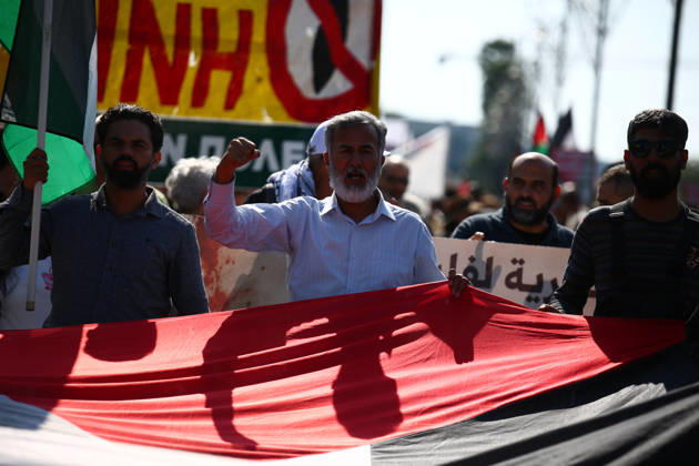 October 10, 2026, Athens, Attica, GREECE: Protesters chant and raise their fists while carrying a large Palestinian flag during a pro-Palestinian march. Athens GREECE - ZUMAx103 20261010_zip_x103_007 Copyright: xHarrisxXanthopoulosx