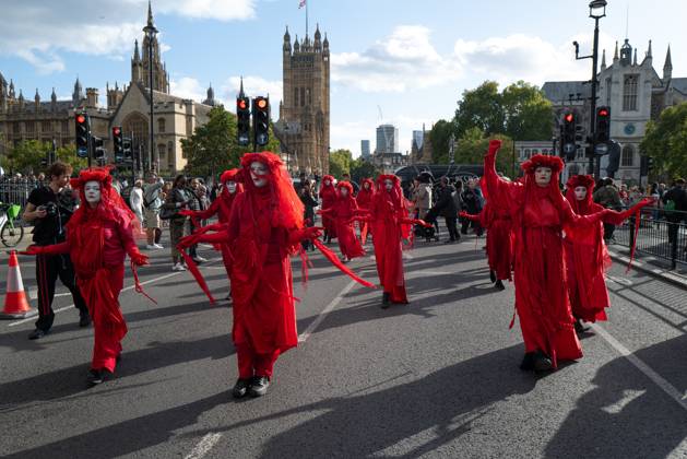 October 10, 2026, London, United Kingdom: Performers from Extinction Rebellion s Red Rebel Brigade stage a silent Walk of Shame procession during the National March for Palestine in London. The National March marks three years since the outbreak of the war in Gaza in October 2023.The National March for Palestine, which was organised by the Palestine Coalition in London. The march marks three years since the outbreak of the war in Gaza in October 2023 London United Kingdom - ZUMAs197 20261010_aaa_s197_062 Copyright: xPhilxLewisx