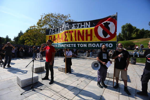 October 10, 2026, Athens, Attica, GREECE: A speaker addresses protesters beneath a large banner calling for freedom for Palestine and an end to the war. Athens GREECE - ZUMAx103 20261010_zip_x103_003 Copyright: xHarrisxXanthopoulosx