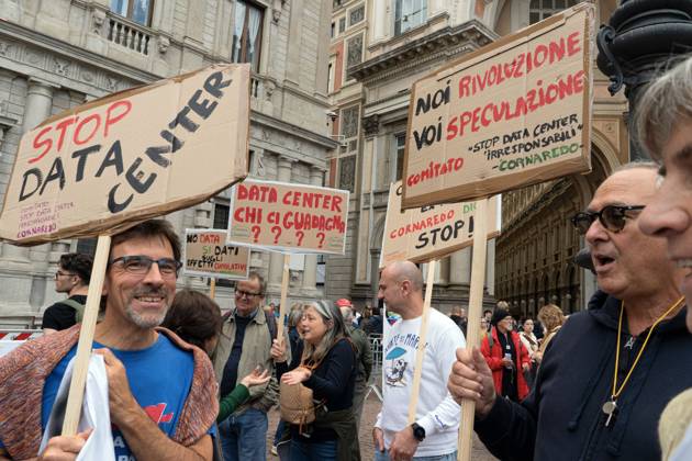 October 7, 2026, Milan, Italy: MILAN, ITALY †OCTOBER 10, 2026: Protesters gather for a sit-in in Piazza della Scala in central Milan to oppose the development of new data centers across Lombardy and Italy. The demonstration is organized by the Rete dei Comitati No Data Center (No Data Center Committee Network), which is calling for a moratorium on permits for new facilities. The group also urges public authorities to conduct thorough environmental, urban planning and regional assessments before approving projects. For approved facilities that have not yet begun operating, campaigners are calling for reviews to be reopened if potential microclimate effects and cumulative impacts with existing facilities were not adequately assessed. - ZUMAq101 20261007_zna_q101_447 Copyright: xCalogeroxRussox