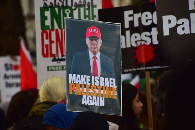 October 10, 2026, London, United Kingdom: A protester holds a Make Israel Palestine Again placard depicting Donald Trump during the National March for Palestine..Thousands of people marched in Central London marking three years of what the protest organisers call the genocide against the Palestinian people in Gaza London United Kingdom - ZUMAs197 20261010_aaa_s197_173 Copyright: xVukxValcicx
