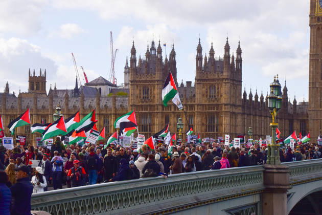 October 10, 2026, London, England, United Kingdom: Protesters pass over Westminster Bridge past the Houses of Parliament during the National March for Palestine. Thousands of people marched in Central London marking three years of what the protest organisers call the genocide against the Palestinian people in Gaza London United Kingdom - ZUMAv130 20261010_zip_v130_073 Copyright: xVukxValcicx