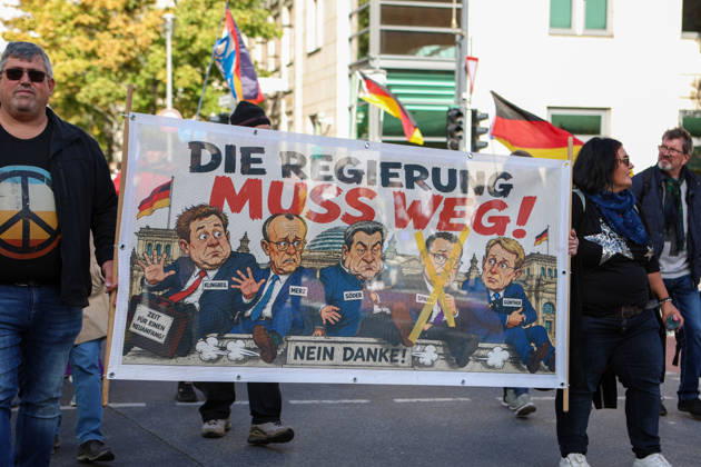 October 10, 2026, Berlin, Berlin, Germany: Demonstrators gather in Berlin for the Project M1llion rally against the German government. Participants take to the streets to voice their opposition to government policies, displaying banners and expressing their political demands. The demonstration brings together people seeking to make their concerns heard and draw public attention to their criticism of the country s political leadership. Berlin Germany - ZUMAc291 20261010_zip_c291_010 Copyright: xMariaxCastrox