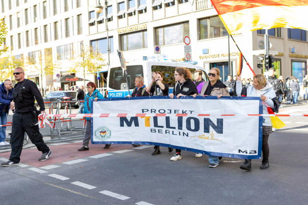 October 10, 2026, Berlin, Berlin, Germany: Demonstrators gather in Berlin for the Project M1llion rally against the German government. Participants take to the streets to voice their opposition to government policies, displaying banners and expressing their political demands. The demonstration brings together people seeking to make their concerns heard and draw public attention to their criticism of the country s political leadership. Berlin Germany - ZUMAc291 20261010_zip_c291_012 Copyright: xMariaxCastrox