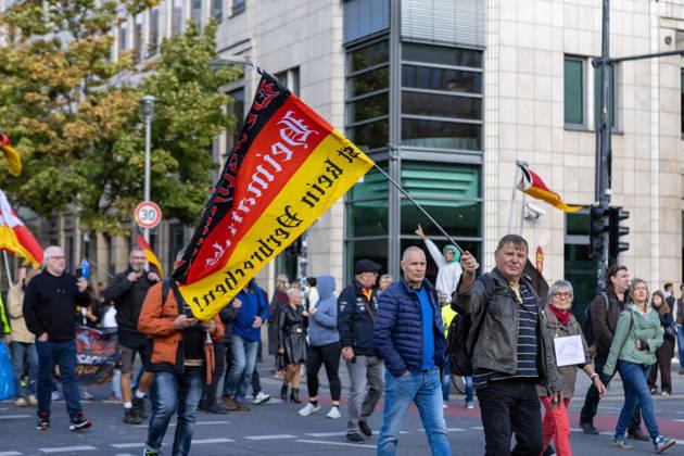 October 10, 2026, Berlin, Berlin, Germany: Demonstrators gather in Berlin for the Project M1llion rally against the German government. Participants take to the streets to voice their opposition to government policies, displaying banners and expressing their political demands. The demonstration brings together people seeking to make their concerns heard and draw public attention to their criticism of the country s political leadership. Berlin Germany - ZUMAc291 20261010_zip_c291_009 Copyright: xMariaxCastrox