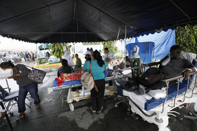 (261010) -- PENONOME, Oct. 10, 2026 -- Patients receive treatment at a temporary shelter after being evacuated from a damaged hospital in Penonome, Panama, Oct. 10, 2026. Panama declared a state of emergency on Saturday to coordinate relief efforts and assist communities affected by a powerful earthquake that struck the country Friday. (Photo by Xinhua) PANAMA-PENONOME-EARTHQUAKE-AFTERMATH DanielxGonzalez