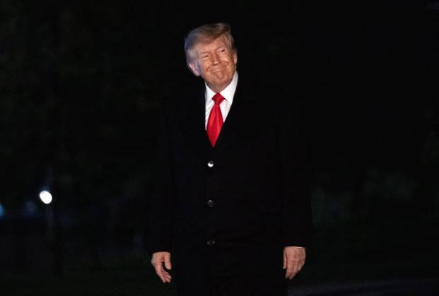 DC: Trump Returns from Clarksville, TN United States President Donald J Trump salutes the Marine Guard as he arrives on the South Lawn of the White House in Washington, DC, USA, from Clarksville, Tennessee, following a campaign rally for Tennessee Republican candidates on the ballot in November, on Saturday, October 10, 2026. Credit: Ron Sachs Pool via CNP. 10 Oct 2026 Pictured: United States President Donald J Trump smiles at the media as he walks to the residence on the South Lawn of the White House in Washington, DC, USA, from Clarksville, Tennessee, following a campaign rally for Tennessee Republican candidates on the ballot in November, on Saturday, October 10, 2026. Credit: Ron Sachs Pool via CNP.  Copyright: xThexMegaxAgencyxRonxSachsx-xPoolxviaxCNPx xMEGAx