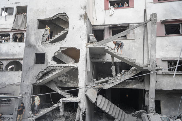 Israeli attack on Az-Zawayda area in Gaza DEIR AL-BALAH, GAZA, PALESTINE - OCTOBER 11: People are seen inside a heavily damaged building following an Israeli airstrike targeting a building belonging to the Buheysi family in the town of Az-Zawayda, near Deir al-Balah in the central Gaza Strip, on October 11, 2026. Israeli forces carried out the strike despite the ceasefire, destroying the targeted building and damaging surrounding structures. Adam Bilal Anadolu Deir Al-Balah Gaza. Editorial use only. Please get in touch for any other usage. Copyright: x2026xAnadoluxAdamxBilalx