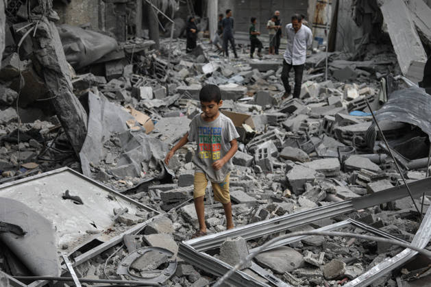 Israeli attack on Az-Zawayda area in Gaza DEIR AL-BALAH, GAZA, PALESTINE - OCTOBER 11: A Palestinian boy walks among the rubble of destroyed buildings following an Israeli airstrike targeting a building belonging to the Buheysi family in the town of Az-Zawayda, near Deir al-Balah in the central Gaza Strip, on October 11, 2026. Israeli forces carried out the strike despite the ceasefire, destroying the targeted building and damaging surrounding structures. Adam Bilal Anadolu Deir Al-Balah Gaza. Editorial use only. Please get in touch for any other usage. Copyright: x2026xAnadoluxAdamxBilalx