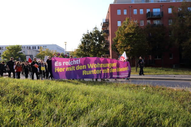 Protesters march along Humboldtring carrying a banner reading Enough is enough! Give us housing! Lower the rents! during a demonstration against the housing crisis and rising rents, Potsdam, October 10, 2026. Rent Protest in Potsdam
