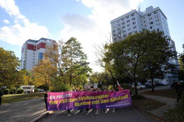 Protesters march along Humboldtring carrying a banner reading Enough is enough! Give us housing! Lower the rents! during a demonstration against the housing crisis and rising rents, Potsdam, October 10, 2026. Rent Protest in Potsdam