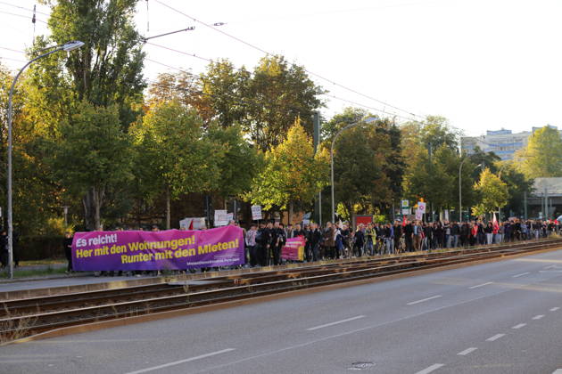 Protesters march down Rudolf Breitscheid Street carrying a banner reading Enough Is Enough—Give Us Apartments, Lower the Rents during a demonstration against the housing crisis and rising rents, Potsdam, October 10, 2026. Rent Protest in Potsdam