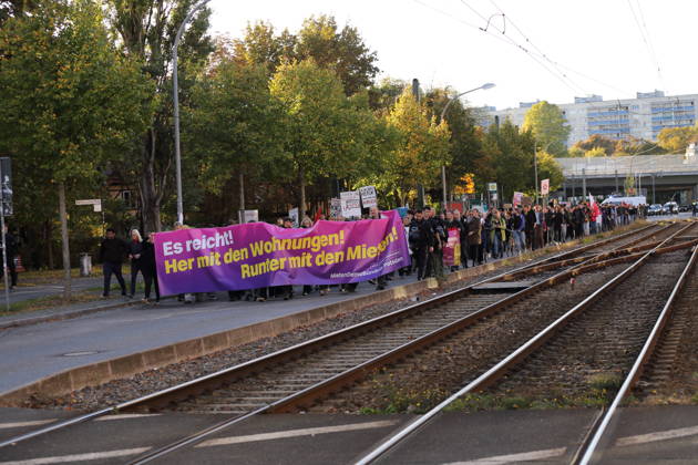 Protesters march down Rudolf Breitscheid Street carrying a banner reading Enough Is Enough—Give Us Apartments, Lower the Rents during a demonstration against the housing crisis and rising rents, Potsdam, October 10, 2026. Rent Protest in Potsdam