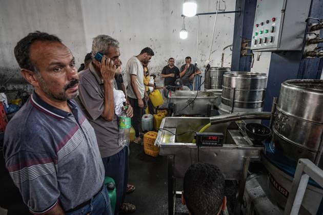 Olive harvest in Gaza despite destruction and access restrictions GAZA STRIP, GAZA, PALESTINE - OCTOBER 11: People work at an olive press facility west of Al-Zawayda as olive oil production continues in the Gaza Strip, Palestine, on October 11, 2026. Palestinian farmers harvest olives from the few trees left standing after Israeli attacks caused extensive damage to agricultural land across the territory, while access to fields in areas designated as the Yellow Line remains restricted. Adam Bilal Anadolu Gaza Gaza. Editorial use only. Please get in touch for any other usage.  Copyright: x2026xAnadoluxAdamxBilalx