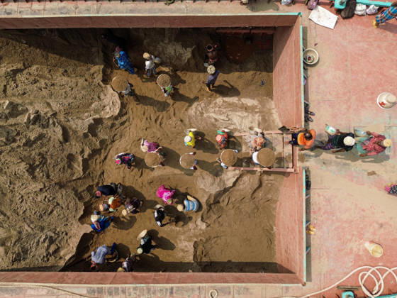 Migrant Workers Unload Sand Workers unload sand at a riverside site in Gabtoli, Dhaka, Bangladesh, on October 11, 2026. Many have left rural communities in search of employment in the capital, where daily labor provides a source of income but often involves strenuous work and limited financial security. Dhaka Bangladesh Copyright: xBipulxAhmedx originalFilename: mondol-notitle261011_nphWo