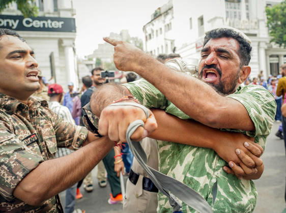 Protester being detained during their protest against CEC Gyanesh Kumar in New Delhi New Delhi, Oct 11 (ANI): A protester being detained during their protest against Chief Election Commissioner Gyanesh Kumar at Palika Bazar, Connaught Place, in New Delhi on Sunday. NEW DELHI Delhi India Copyright: xANIx ANI_20261011130