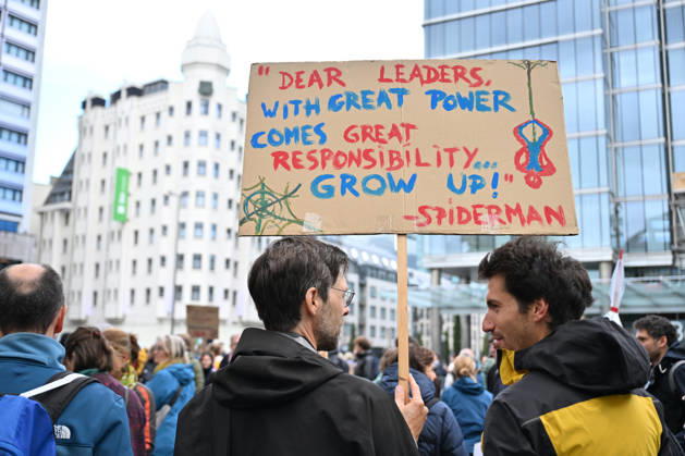 Tens of thousands march in Brussels demanding stronger climate action BRUSSELS, BELGIUM - OCTOBER 11: Demonstrators hold climate-themed placards as tens of thousands of people march through Brussels calling for stronger action against climate change and reduced dependence on fossil fuels, on October 11, 2026 in Brussels, Belgium. The protest was organized by the Belgian Climate Coalition, which brings together around 100 civil society organizations. Participants marched along major roads toward Schuman Square, home to several European Union institutions, while protesting the government s climate policies. Dursun Aydemir Anadolu Brussels Belgium. Editorial use only. Please get in touch for any other usage. Copyright: x2026xAnadoluxDursunxAydemirx