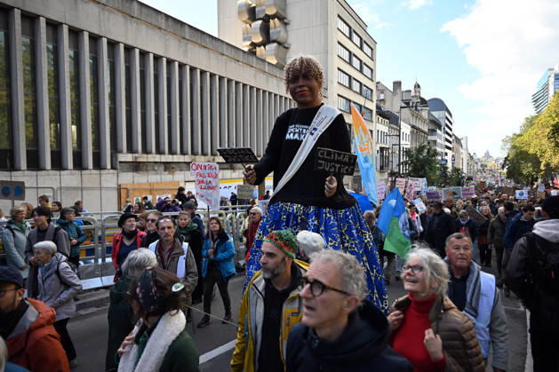 Tens of thousands march in Brussels demanding stronger climate action BRUSSELS, BELGIUM - OCTOBER 11: Demonstrators hold climate-themed placards as tens of thousands of people march through Brussels calling for stronger action against climate change and reduced dependence on fossil fuels, on October 11, 2026 in Brussels, Belgium. The protest was organized by the Belgian Climate Coalition, which brings together around 100 civil society organizations. Participants marched along major roads toward Schuman Square, home to several European Union institutions, while protesting the government s climate policies. Dursun Aydemir Anadolu Brussels Belgium. Editorial use only. Please get in touch for any other usage. Copyright: x2026xAnadoluxDursunxAydemirx