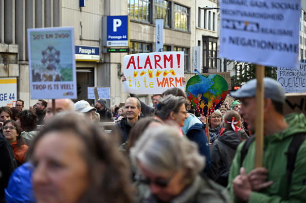Tens of thousands march in Brussels demanding stronger climate action BRUSSELS, BELGIUM - OCTOBER 11: Demonstrators hold climate-themed placards as tens of thousands of people march through Brussels calling for stronger action against climate change and reduced dependence on fossil fuels, on October 11, 2026 in Brussels, Belgium. The protest was organized by the Belgian Climate Coalition, which brings together around 100 civil society organizations. Participants marched along major roads toward Schuman Square, home to several European Union institutions, while protesting the government s climate policies. Dursun Aydemir Anadolu Brussels Belgium. Editorial use only. Please get in touch for any other usage. Copyright: x2026xAnadoluxDursunxAydemirx