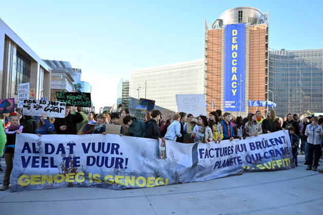 Tens of thousands march in Brussels demanding stronger climate action BRUSSELS, BELGIUM - OCTOBER 11: Demonstrators hold climate-themed placards as tens of thousands of people march through Brussels calling for stronger action against climate change and reduced dependence on fossil fuels, on October 11, 2026 in Brussels, Belgium. The protest was organized by the Belgian Climate Coalition, which brings together around 100 civil society organizations. Participants marched along major roads toward Schuman Square, home to several European Union institutions, while protesting the government s climate policies. Dursun Aydemir Anadolu Brussels Belgium. Editorial use only. Please get in touch for any other usage. Copyright: x2026xAnadoluxDursunxAydemirx