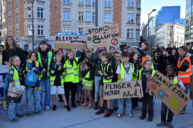 Tens of thousands march in Brussels demanding stronger climate action BRUSSELS, BELGIUM - OCTOBER 11: Demonstrators hold climate-themed placards as tens of thousands of people march through Brussels calling for stronger action against climate change and reduced dependence on fossil fuels, on October 11, 2026 in Brussels, Belgium. The protest was organized by the Belgian Climate Coalition, which brings together around 100 civil society organizations. Participants marched along major roads toward Schuman Square, home to several European Union institutions, while protesting the government s climate policies. Dursun Aydemir Anadolu Brussels Belgium. Editorial use only. Please get in touch for any other usage. Copyright: x2026xAnadoluxDursunxAydemirx