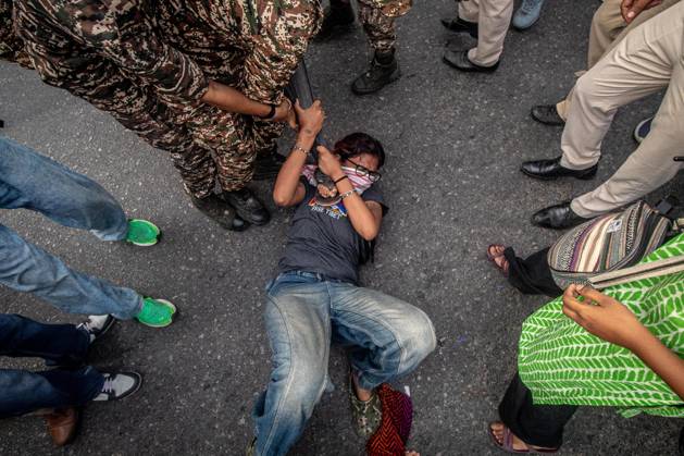 Protest to demand resignation of India s chief election commissioner in New Delhi NEW DELHI, INDIA - OCTOBER 11: Indian police officers detain a protestor during a mass protest organized by the Cockroach Janta Party (CJP) in New Delhi, India on October 11, 2026. Demonstrators gathered to demand the resignation of Chief Election Commissioner Gyanesh Kumar over alleged electoral roll irregularities and revisions. Yousuf Sarfaraz Anadolu New Delhi India. Editorial use only. Please get in touch for any other usage. Copyright: x2026xAnadoluxYousufxSarfarazx