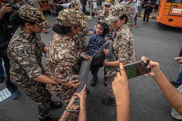 Protest to demand resignation of India s chief election commissioner in New Delhi NEW DELHI, INDIA - OCTOBER 11: Indian police officers detain a protestor during a mass protest organized by the Cockroach Janta Party (CJP) in New Delhi, India on October 11, 2026. Demonstrators gathered to demand the resignation of Chief Election Commissioner Gyanesh Kumar over alleged electoral roll irregularities and revisions. Yousuf Sarfaraz Anadolu New Delhi India. Editorial use only. Please get in touch for any other usage. Copyright: x2026xAnadoluxYousufxSarfarazx