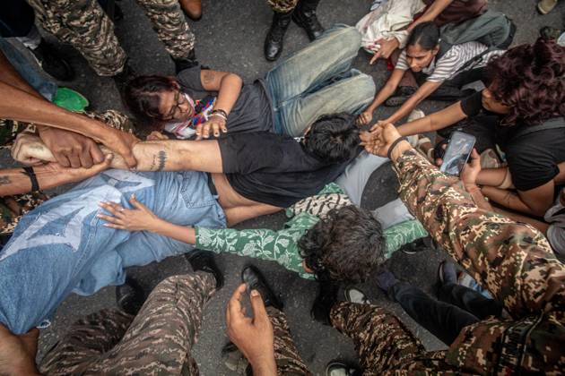 Protest to demand resignation of India s chief election commissioner in New Delhi NEW DELHI, INDIA - OCTOBER 11: Indian police officers detain a protestor during a mass protest organized by the Cockroach Janta Party (CJP) in New Delhi, India on October 11, 2026. Demonstrators gathered to demand the resignation of Chief Election Commissioner Gyanesh Kumar over alleged electoral roll irregularities and revisions. Yousuf Sarfaraz Anadolu New Delhi India. Editorial use only. Please get in touch for any other usage. Copyright: x2026xAnadoluxYousufxSarfarazx