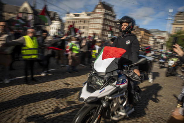 October 11, 2026, Amsterdam, North Holland, The Netherlands - Holland: 11 October 2026, Amsterdam, the Netherlands: The group Bikers for Palestine departs from Dam Square. Protesters gathered at Dam Square for speeches and anti-war music before marching through AmsterdamÃ¢â‚¬â ¢s city centre in a demonstration dubbed Ã¢â‚¬oeThree Years of GenocideÃ¢â‚¬Â. The event marked three years since the start of the IsraelÃ¢â‚¬Hamas war. Demonstrators carried Palestinian flags and banners, demanding the Dutch government act against what they describe as a genocide in Gaza. Amsterdam The Netherlands - Holland - ZUMAp202 20261011_zip_p202_008 Copyright: xJamesxPetermeierx