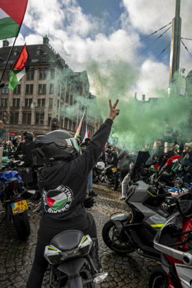 October 11, 2026, Amsterdam, North Holland, The Netherlands - Holland: 11 October 2026, Amsterdam, the Netherlands: Bikers for Palestine members set off smoke flares at Dam Square. Protesters gathered at Dam Square for speeches and anti-war music before marching through AmsterdamÃ¢â‚¬â ¢s city centre in a demonstration dubbed Ã¢â‚¬oeThree Years of GenocideÃ¢â‚¬Â. The event marked three years since the start of the IsraelÃ¢â‚¬Hamas war. Demonstrators carried Palestinian flags and banners, demanding the Dutch government act against what they describe as a genocide in Gaza. Amsterdam The Netherlands - Holland - ZUMAp202 20261011_zip_p202_010 Copyright: xJamesxPetermeierx